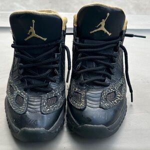 Jordan 11 retro low Black and Gold Sneakers